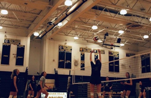 Girls playing volley ball.