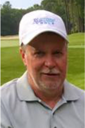 A headshot of a man in a white baseball cap.