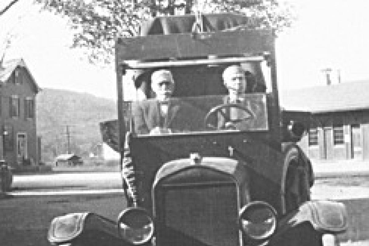 Seen here in about 1910 is Mr. Forshay, on the right, with an associate making his way up Yawpo Avenue that was then a dirt road. In the background on the right is the old railroad station. It wasn't until the 1940s that Yawpo Avenue was extended into Franklin Lakes.