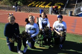 The cheerleaders enjoying a great day at the field!