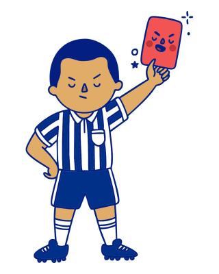 Soccer referee blowing whistle and holding red penalty card.