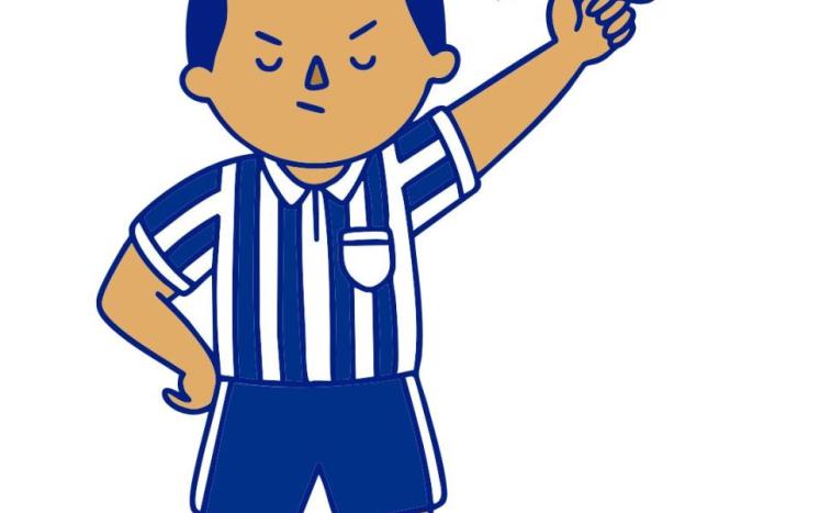Soccer referee blowing whistle and holding red penalty card.